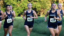 Lacey Updike and Allison Thompson running cross country