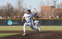 Graham Kasey pitching in white UIS uniform