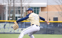 Derek Huber pitching in golf UIS uniform