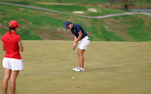 Valentina Torrealba playing golf in blue UIS gear
