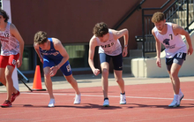 Lucas Naugle on starting line in outdoor track