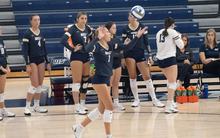Madeline Mendelblatt serving the ball 