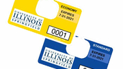 Two parking decals for the University of Illinois Springfield, one yellow, one blue.