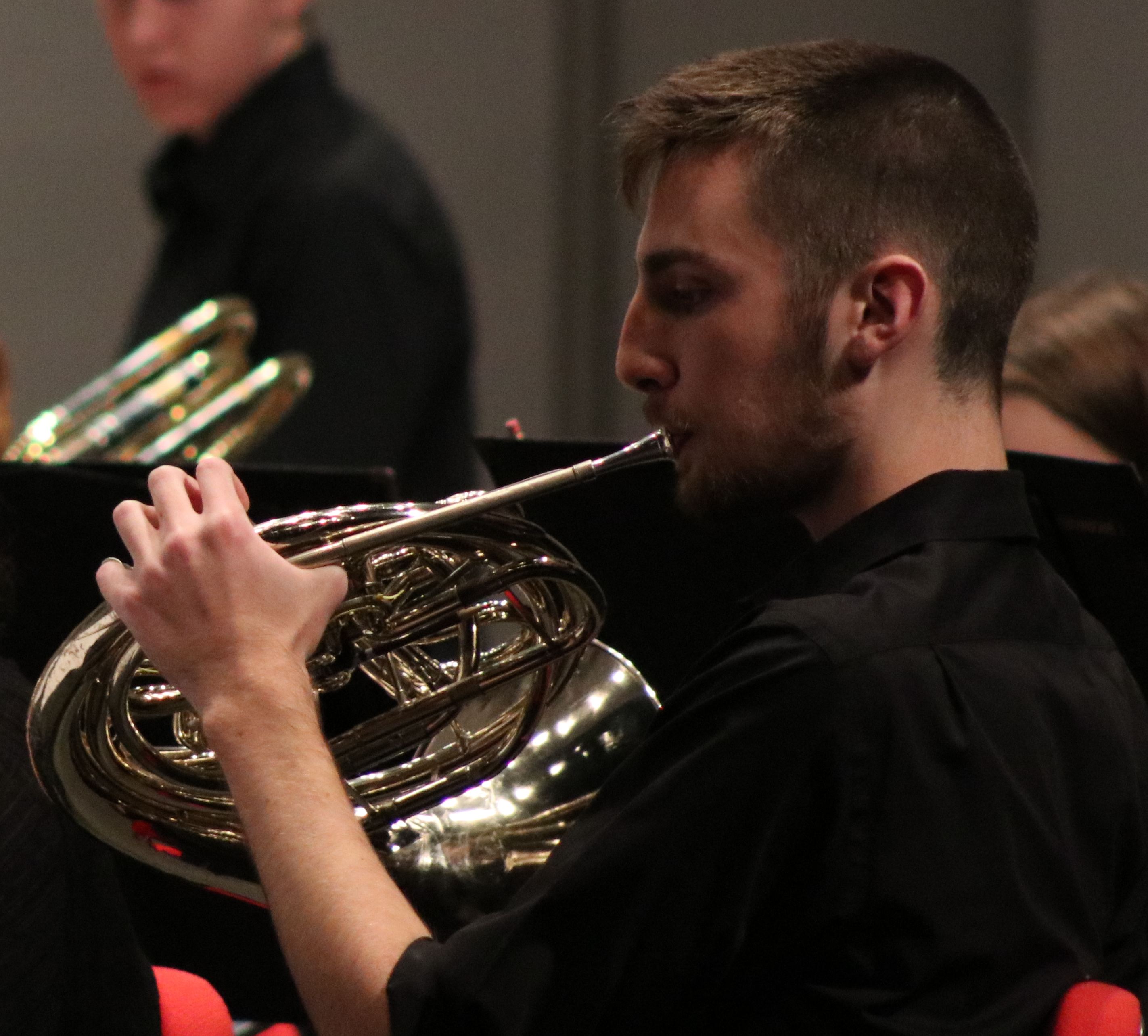 Musician playing french horn