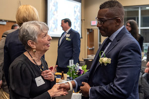 two people chatting at an Advancement event