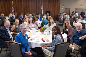 people posing for a group photo at an Advancement event