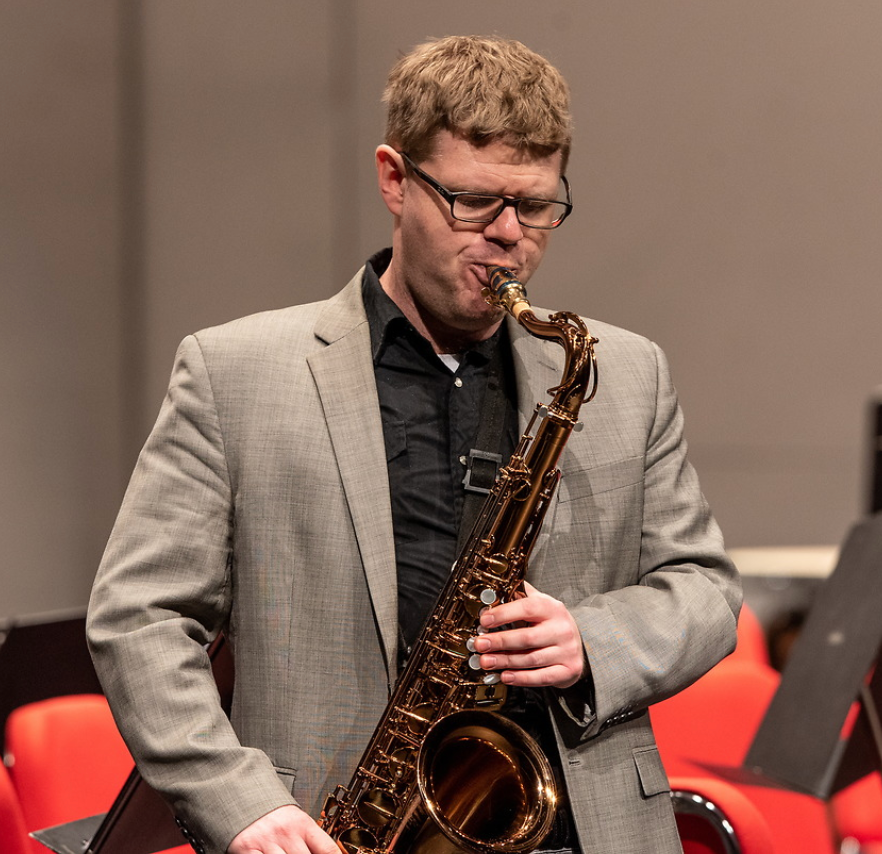 Person playing saxophone