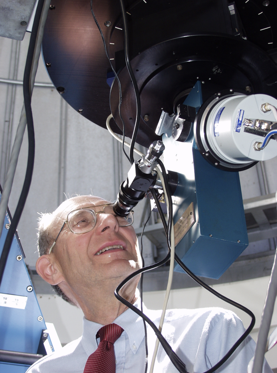 Man looking into a telescope