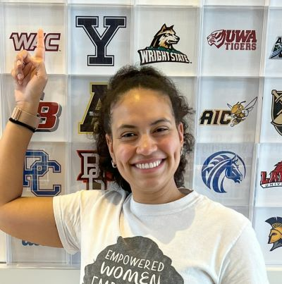 headshot of Regina Bolin in front of a wall with many university logos