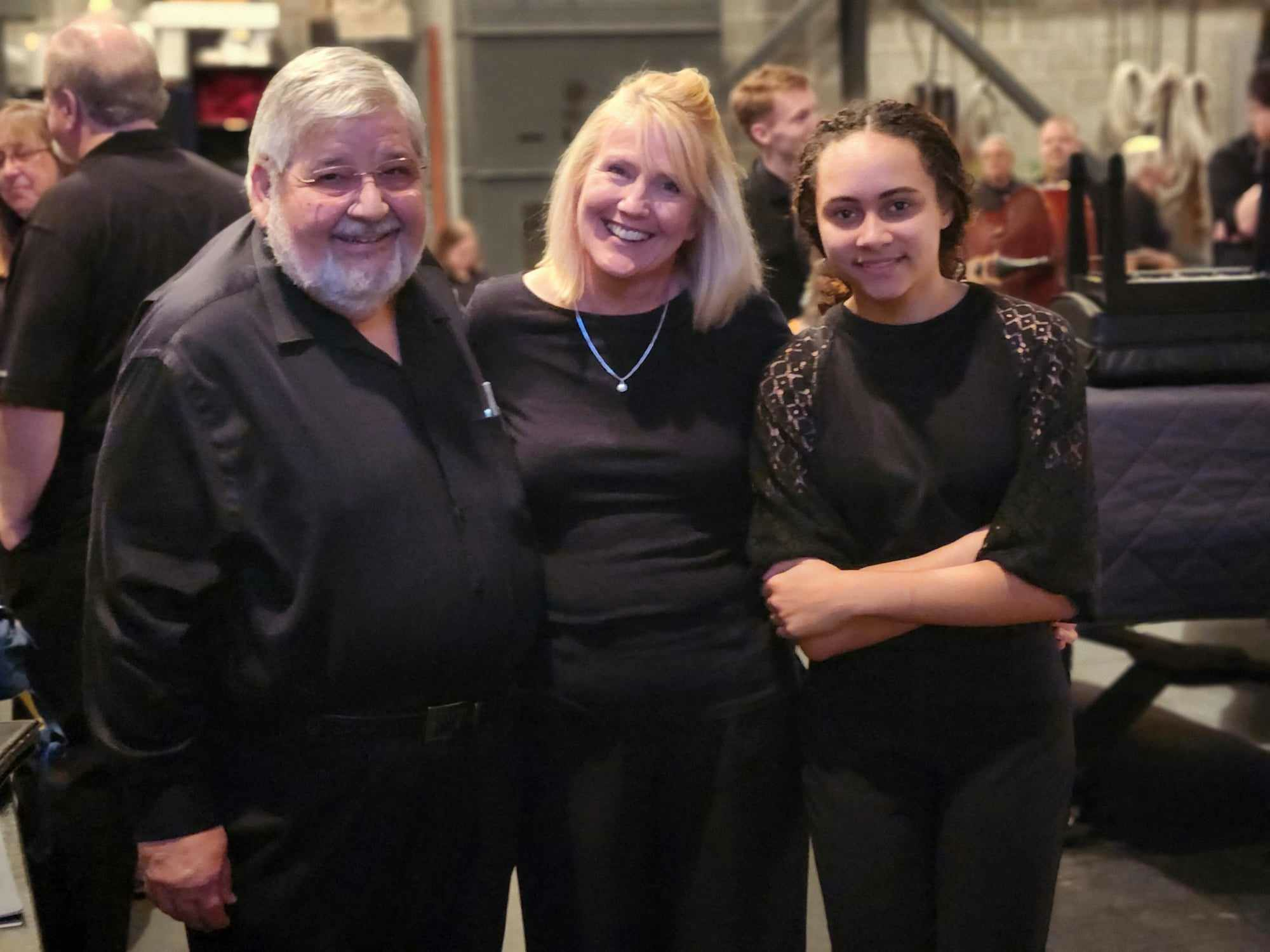 Three musicians taking a picture together