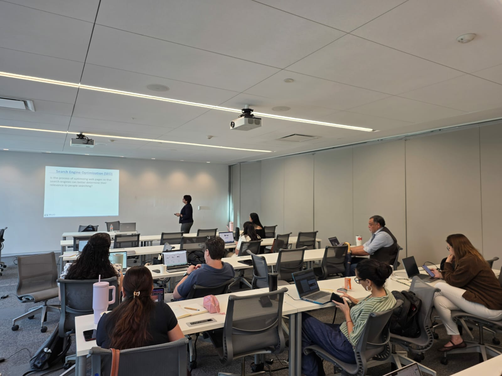 Shipra Gupta presents during a digital marketing and analytics workshop attended by faculty and staff.