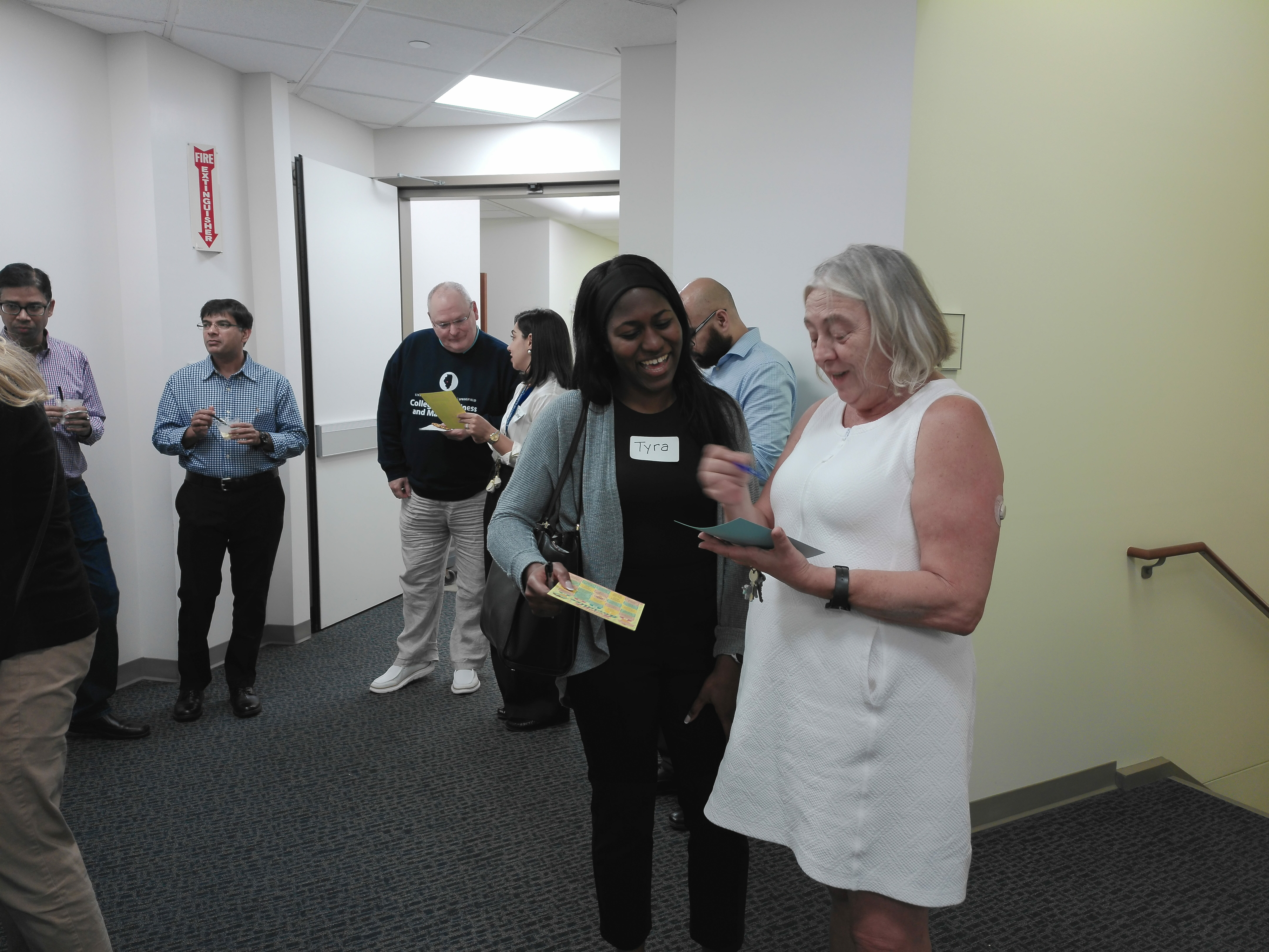 Attendees chat and complete bingo cards during Scoop & Socialize.