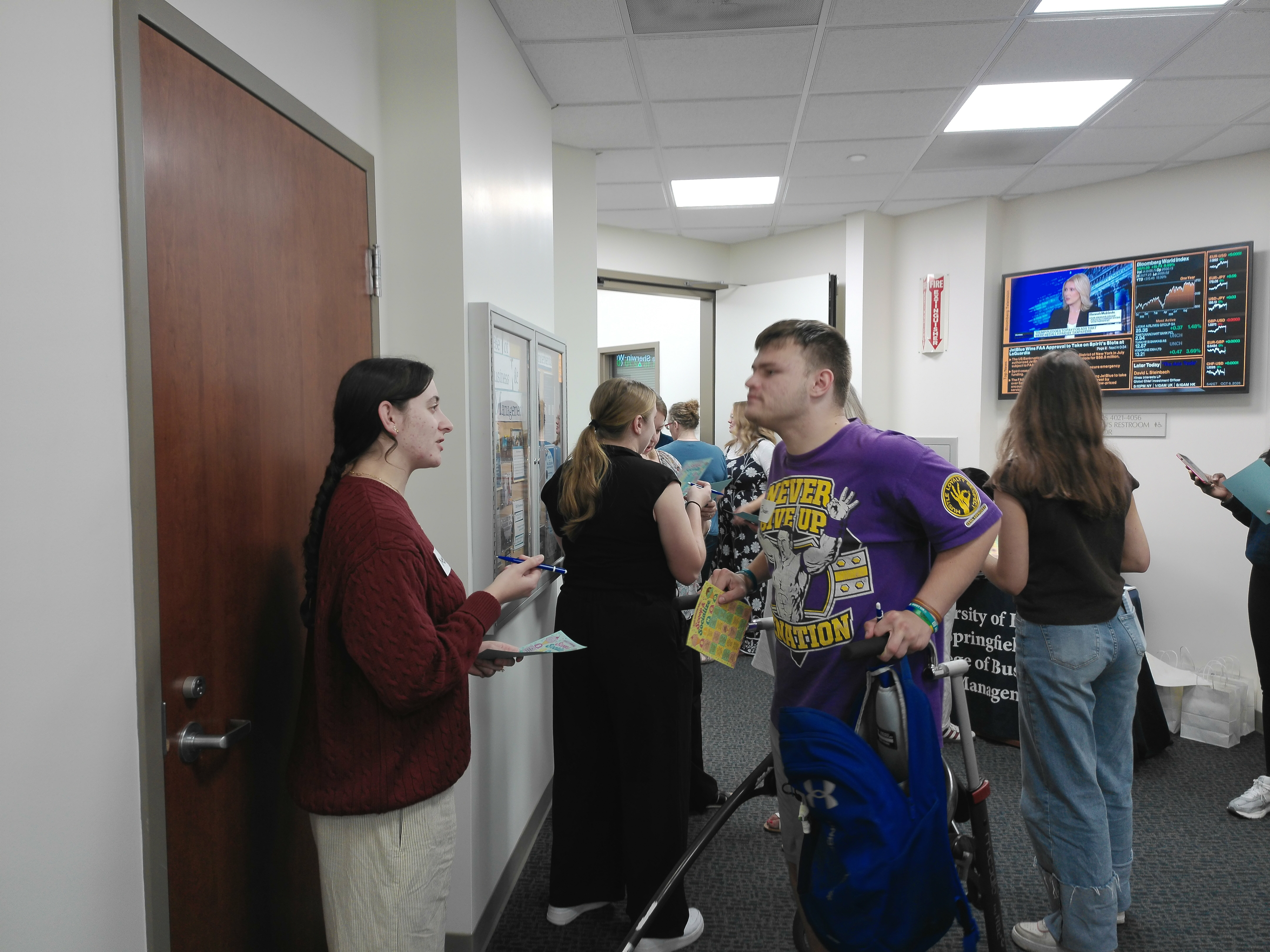 - MBA students participate in a bingo activity during the Scoop & Socialize event.