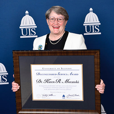 Karen Moranski holding award