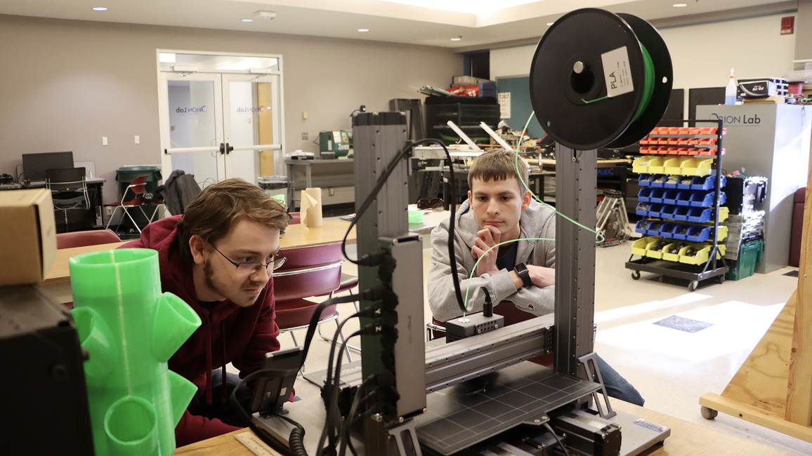 Two UIS students using equipment in the Orion Lab. 