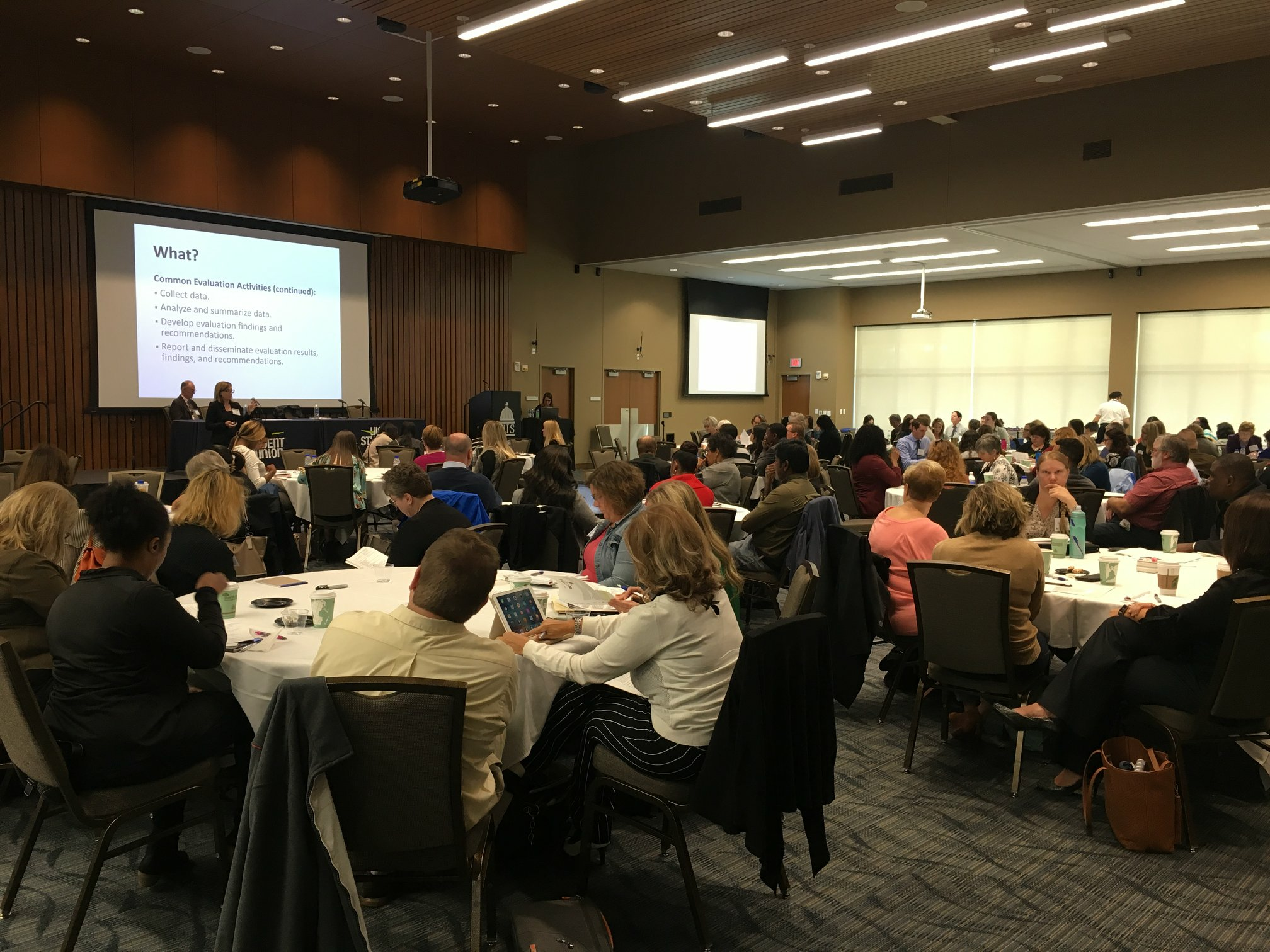 audience at luncheon listening to presentation