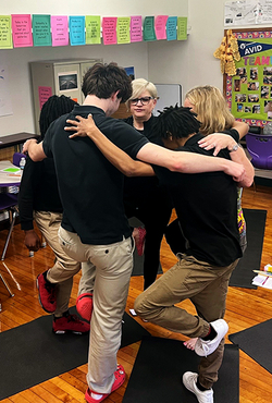 Jennifer Martin teaches students yoga