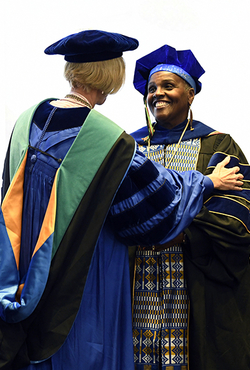 Hoff receives the Presidential Professor medallion.