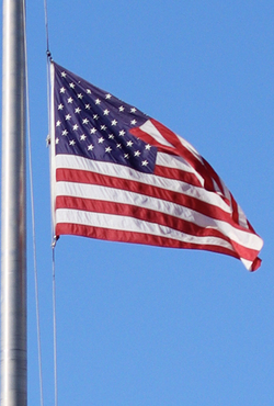 An American flag on a flagpole 