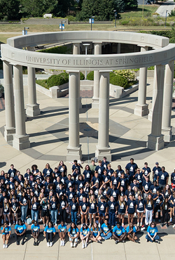 A mass group shot of the UIS Class of 2029 in front of the colonnade. 