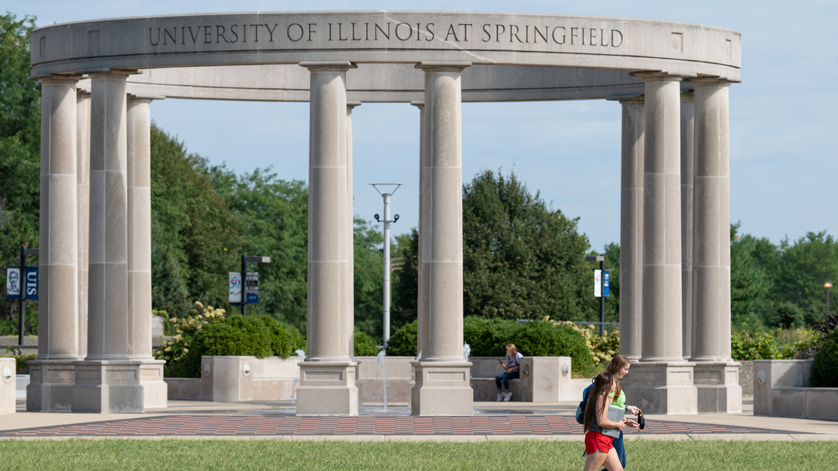 Students walk by UIS Colonnade