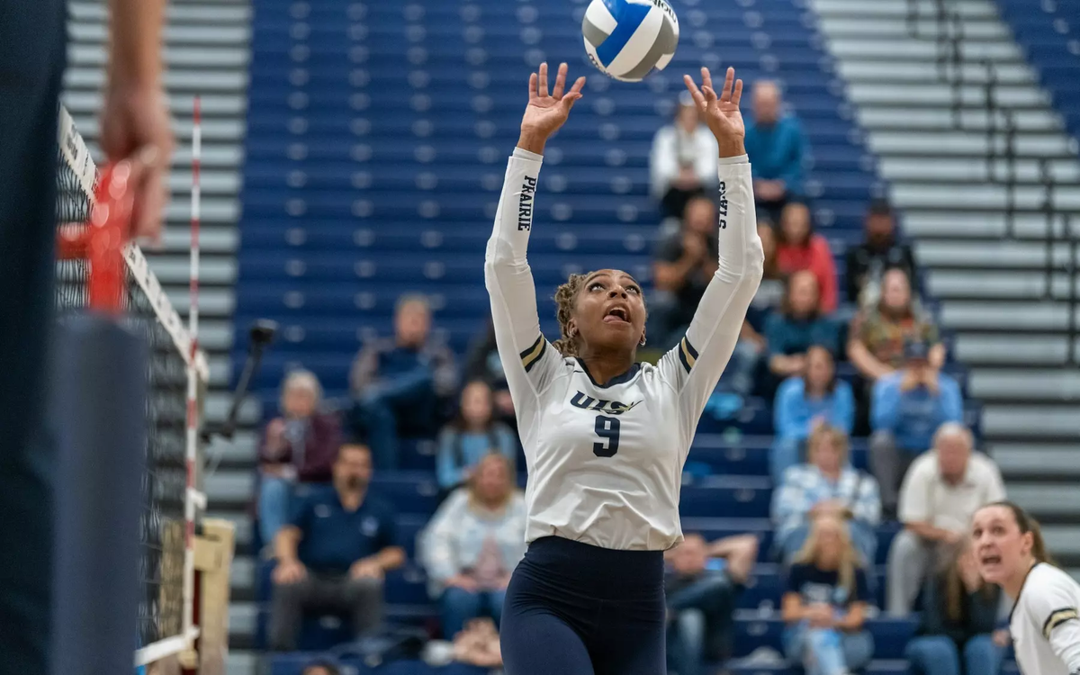 Erica Sledge setting the ball