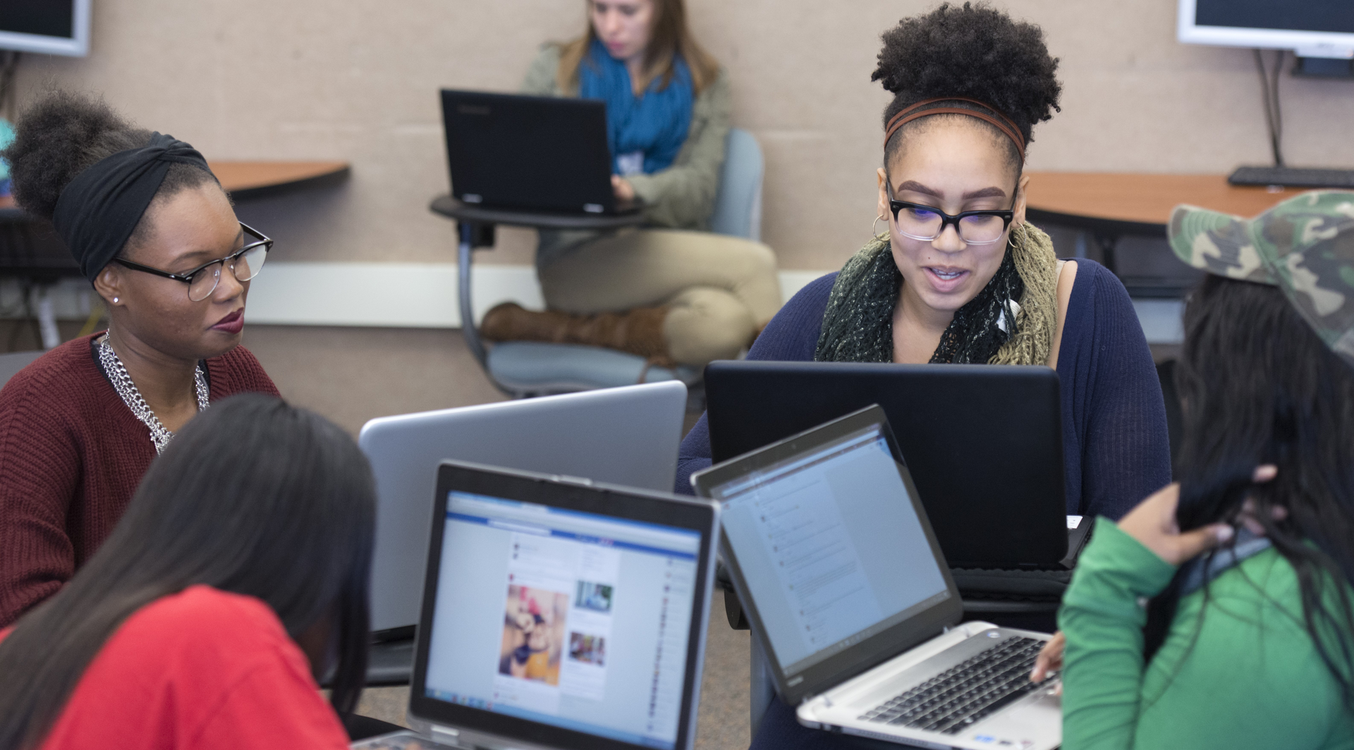 English subpage image, students working on laptops