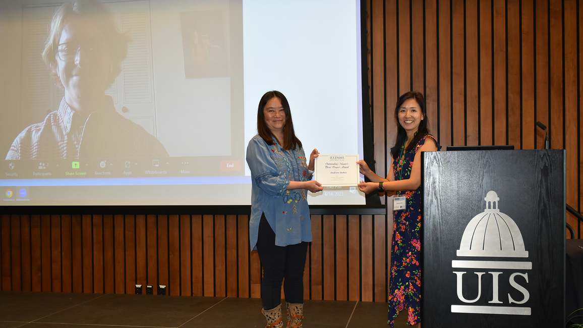 Faculty holding award