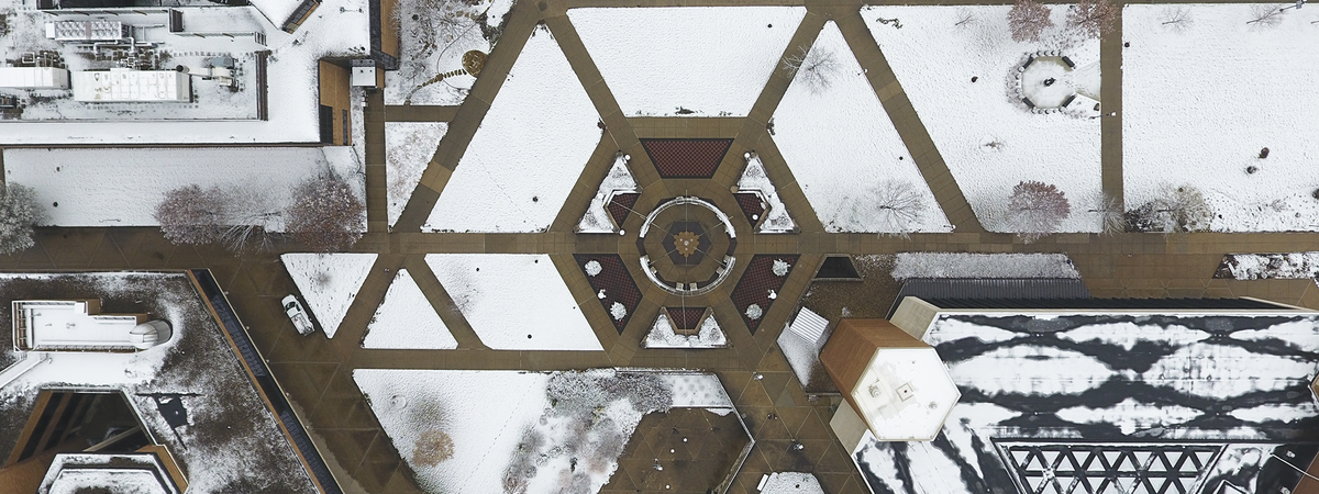 aerial view of UIS quad covered in snow