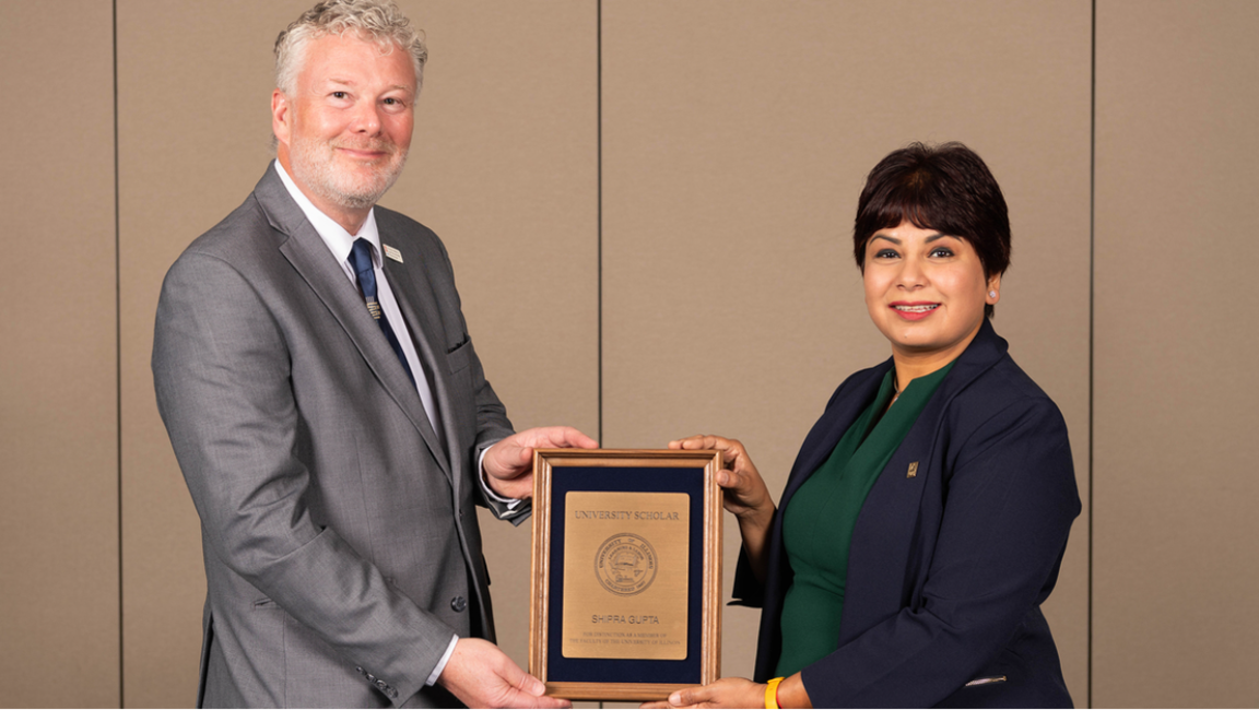 Professor Shipra Gupta receiving the 2023 University Scholar Award.