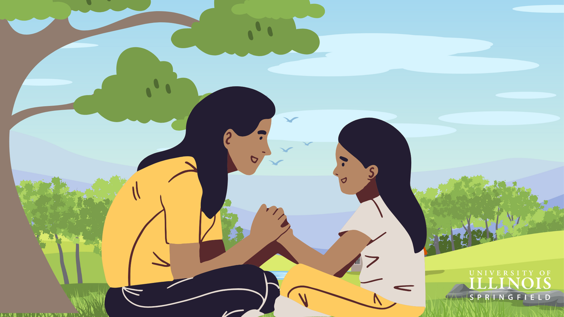 A mother and daughter sitting under a tree.