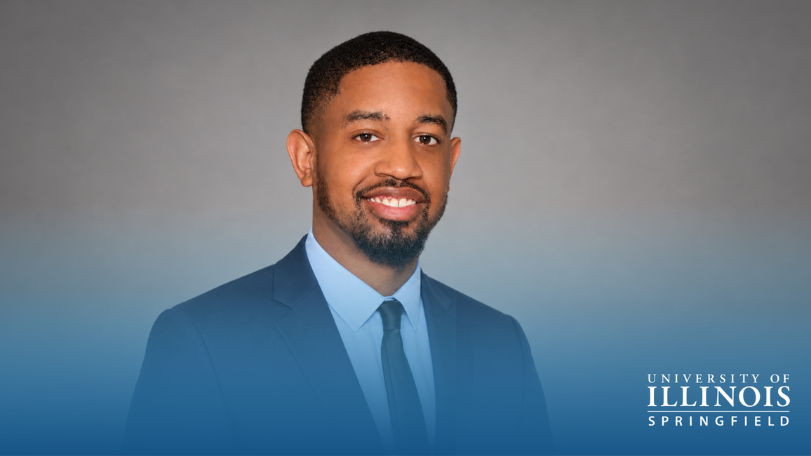 Man in a suit smiling against a dark gradient background with University of Illinois Springfield logo.