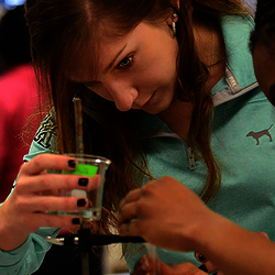 chemistry students performing an experiment