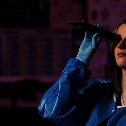 student performing microbiology testing