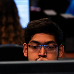 student behind computer screen