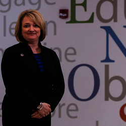teacher in front of word wall