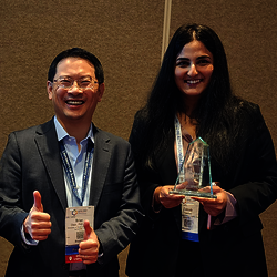 Brian Chen and Zainab Yaseen pose with the award.