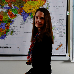 professor in front of map