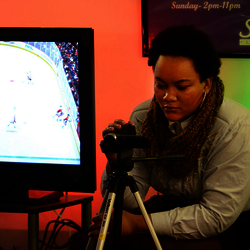 student photographing another student