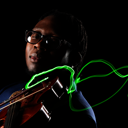 student playing violin with neon bow