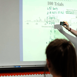 a UIS student teaching high school students