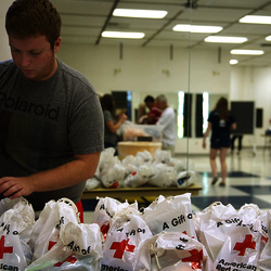 a student volunteer making emergency kits for the Red Cross