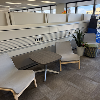 Two grey chairs with small table