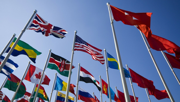 Different country's flags flying in the sky