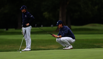 UIS golfer scouting a putt