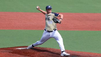 Brayden Mayer pitching for UIS baseball in gold uniform