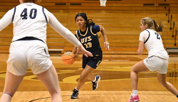 Emari Doby driving up the court