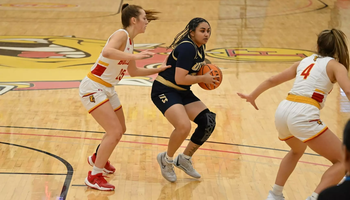 Amaya Asher playing basketball