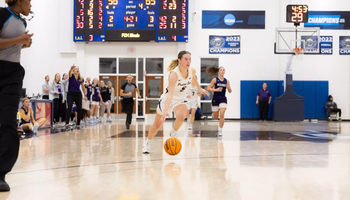 Julia Mingus dribbles down the court