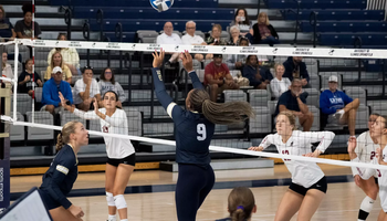 Erica Sledge setting in volleyball match 